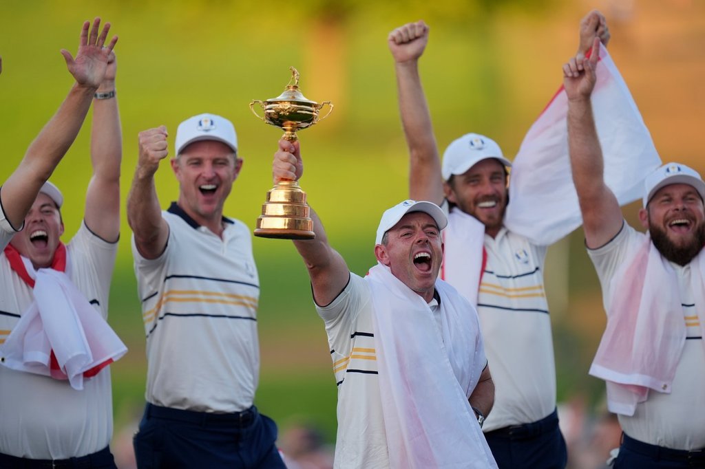 Europe's Rory McIlroy poses with the trophy after winning the Ryder Cup golf tournament against the United States on the Bethpage Black golf course, Sunday, Sept. 28, 2025, in Farmingdale, N.Y.