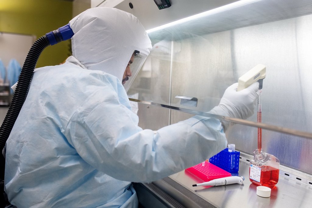 Vaccine and Infectious Disease Organization (VIDO) researchers demonstrate work in a Containment Level 3 lab during a tour of the building on the University of Saskatchewan in Saskatoon, Sask. on Thursday, August 21, 2025. THE CANADIAN PRESS/Liam Richards.